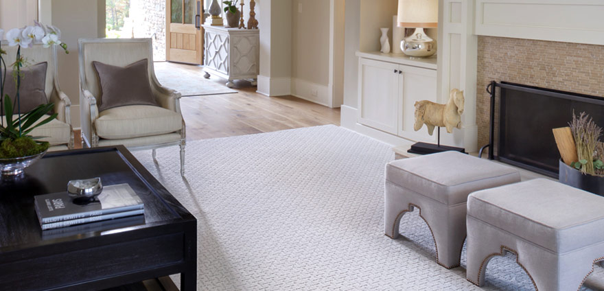 Layer your hardwood flooring with an area rug for added comfort; via Karastan